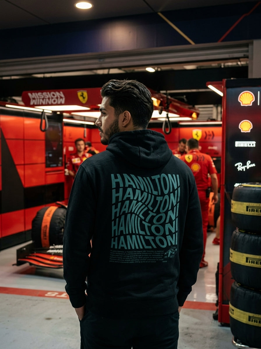 Modelo hombre con hoodie Hamilton en paddock Ferrari · Lewis Hamilton Merch Drive Gear